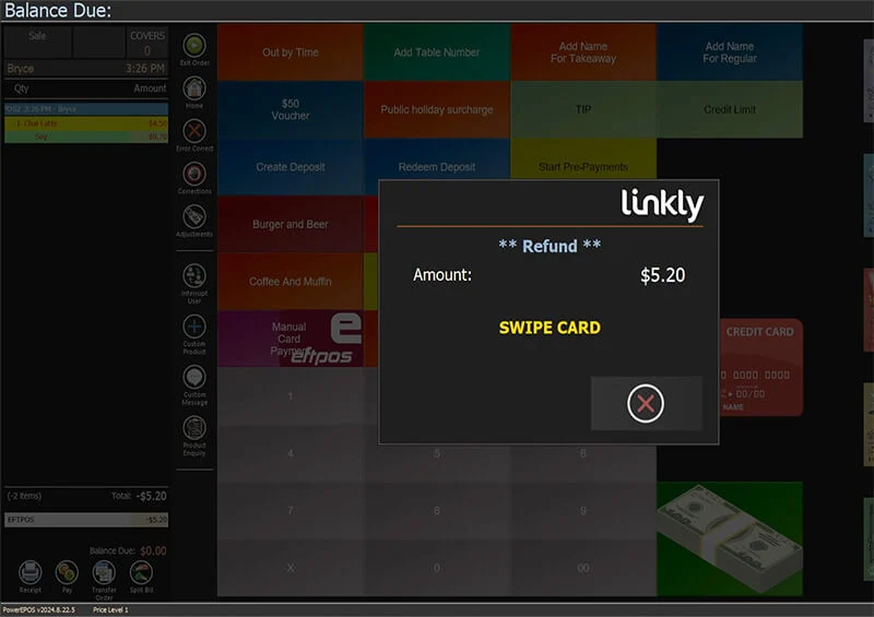 The EFTPOS terminal prompting the customer to present their card